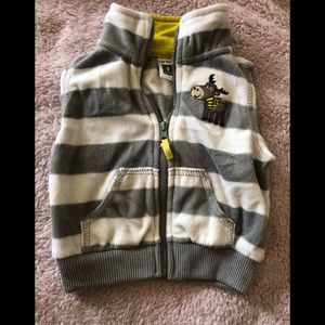 Adorable grey and white striped fleece vest.